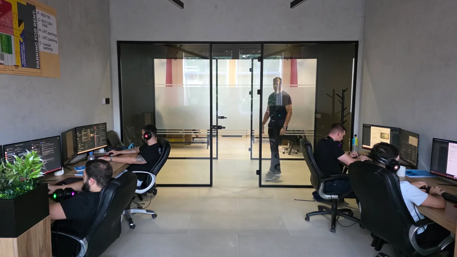 Members of the Millennials Maintenance operations team working at computer stations.
